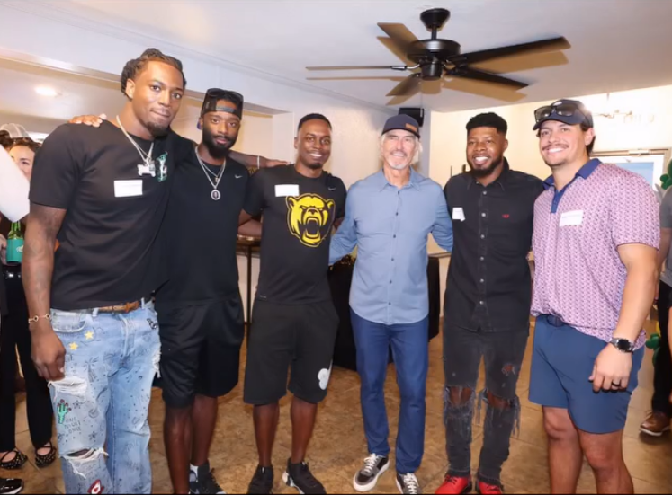 Art Briles standing with Ishmael Zamora and his Baylor teammates, capturing highlights from the Hall of Fame events honoring their team